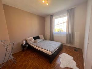 Postel nebo postele na pokoji v ubytování Centrum Szeged Apartman