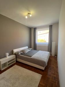 Postel nebo postele na pokoji v ubytování Centrum Szeged Apartman