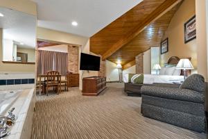 a hotel room with a bed and a television at Quality Inn - Storm Lake in Storm Lake