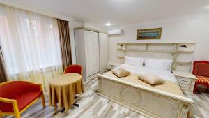 Postel nebo postele na pokoji v ubytování Aspar Boutique Hotel
