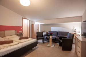 A bed or beds in a room at Blaiken Appartements in Scheffau am Wilden Kaiser