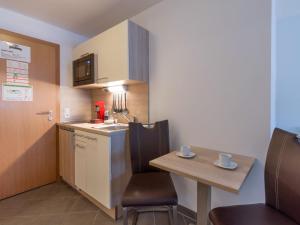 A kitchen or kitchenette at Blaiken Appartements in Scheffau am Wilden Kaiser