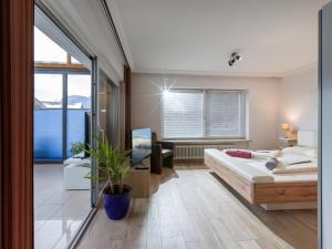 A bed or beds in a room at Blaiken Appartements in Scheffau am Wilden Kaiser