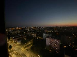 a view of a city at night with lights at HANZA TOWER HIGH FLOOR Swimming Pool & Spa in Szczecin