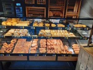 a display case in a bakery filled with lots of pastries at 2 bedroom Centre apartment in Podgorica