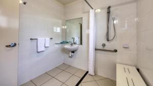 a bathroom with a sink and a shower at Chinchilla Motor Inn in Chinchilla