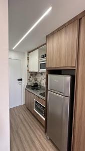 A kitchen or kitchenette at Moov 1417 Studio Mooca