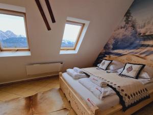 Posteľ alebo postele v izbe v ubytovaní Apartament Butorowy Kościelisko