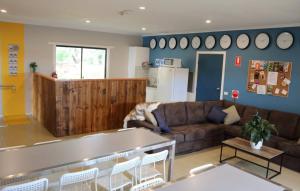 a living room with a couch and a table at 13th Apostle Accommodation in Princetown