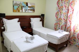 Cama o camas de una habitación en Mindelo Residencial