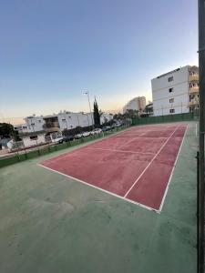 an empty tennis court in a parking lot at Apartment Modern 2 Playa del Ingles in San Bartolomé de Tirajana