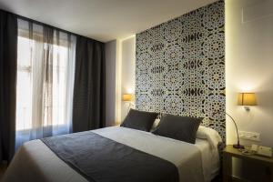 Posteľ alebo postele v izbe v ubytovaní Hotel Comfort Dauro 2