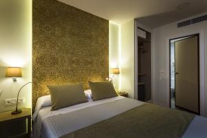 Posteľ alebo postele v izbe v ubytovaní Hotel Comfort Dauro 2