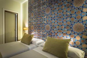Posteľ alebo postele v izbe v ubytovaní Hotel Comfort Dauro 2