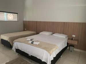 Ένα ή περισσότερα κρεβάτια σε δωμάτιο στο Haras Paraíso do Atlântico