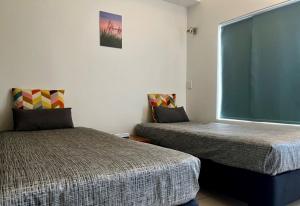 Ayr Traveller's Motel客房内的一张或多张床位