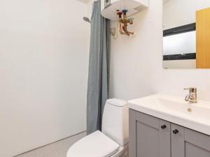 a bathroom with a toilet and a sink at 6 person holiday home in Væggerløse-By Traum in Marielyst +44 photos
