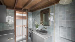 a bathroom with a sink and a mirror at Blairs in Dinner Plain