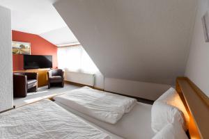 Postel nebo postele na pokoji v ubytování Hotel Fröhlich-Höche