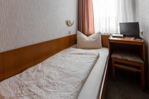 Postel nebo postele na pokoji v ubytování Hotel Fröhlich-Höche