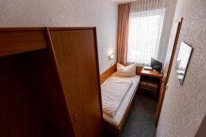 Postel nebo postele na pokoji v ubytování Hotel Fröhlich-Höche