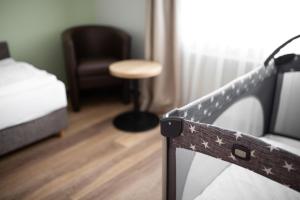 Postel nebo postele na pokoji v ubytování Hotel Fröhlich-Höche