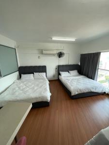 Katil atau katil-katil dalam bilik di 4PAX near USM n Pantai Hospital n PISA SPI CE ARENA +26 gambar