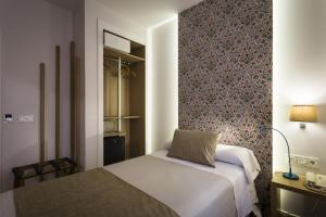 Posteľ alebo postele v izbe v ubytovaní Hotel Comfort Dauro 2