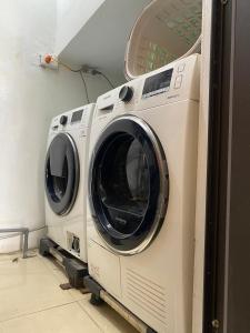 a washer and dryer sitting in a room at O Zoli Home in Ninh Binh