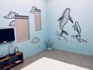 TV tai viihdekeskus majoituspaikassa Divewhale Homestay