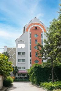 a building with an arch on top of it at Bella Villa Pattaya 3rd Road in Pattaya