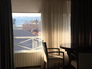 a room with a table and a window with a view at Şirin Hotel in Istanbul