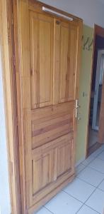 a wooden door in a room at Levendula in Békéscsaba