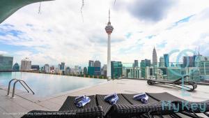 a rooftop swimming pool with a view of the city at Ceylonz Suites by MyKey in Kuala Lumpur +96 photos