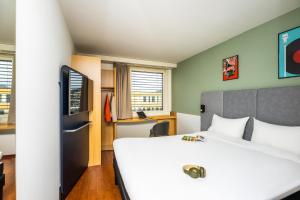 Postel nebo postele na pokoji v ubytování ibis Baar Zug + 28 fotografií