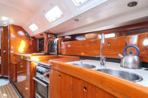 a kitchen with a sink and a tea kettle at 53ft Sailing Yacht PHUKET Family Sailing adventure in Bang Tao Beach