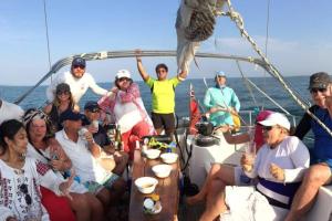 a group of people sitting on a boat at 53ft Sailing Yacht PHUKET Family Sailing adventure in Bang Tao Beach