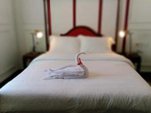 Ένα ή περισσότερα κρεβάτια σε δωμάτιο στο Mruyung Guest House Kota Lama Banyumas Mitra RedDoorz