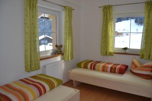 Łóżko lub łóżka w pokoju w obiekcie Apartment Santnerhof