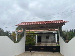 a gate to a house with a fence at Villa Piña Alojamiento rural in San Rafael