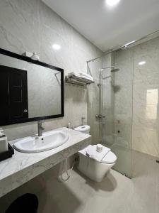 a bathroom with a sink and a toilet and a shower at May Studio in Da Lat +36 photos