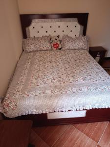 a teddy bear sitting on top of a bed at Fully furnished condo in the center of addis ababa in Addis Ababa