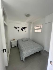 Säng eller sängar i ett rum på Apartamento Los Cisnes