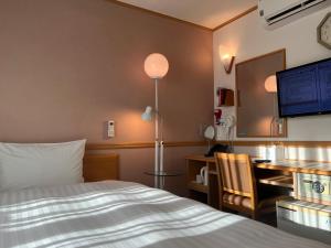 Postel nebo postele na pokoji v ubytování Toyoko Inn Busan Seomyeon