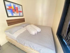 Gallery image of De Homestay Mitra RedDoorz Bitung in Bitung +29 photos