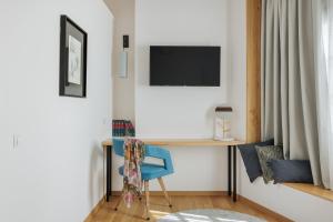 TV a/nebo společenská místnost v ubytování Petrou Suites