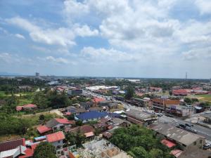 an overhead view of a city with buildings and a street at The Viana Apartment 2 in Kota Bharu