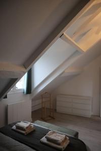 Posteľ alebo postele v izbe v ubytovaní Appart'Hôtel Blois vue Château