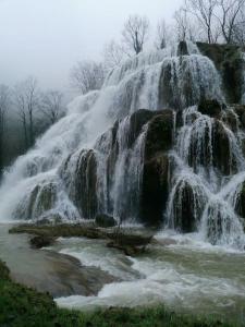 a waterfall with water pouring out of it at Studio cosy in Lons-le-Saunier