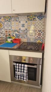 A kitchen or kitchenette at La piccola Perla